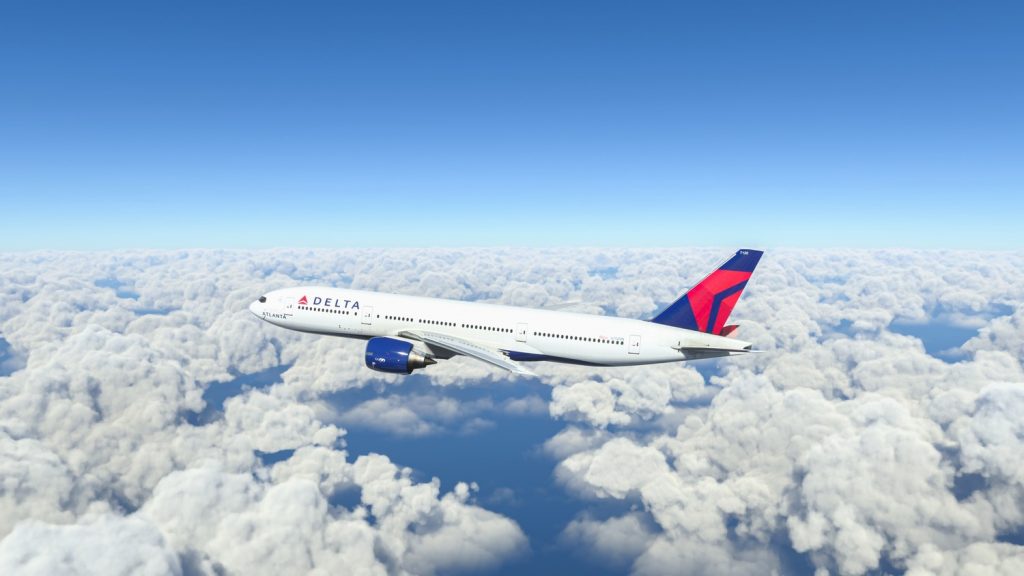 Boeing 777 Delta Airlines flying over the clouds