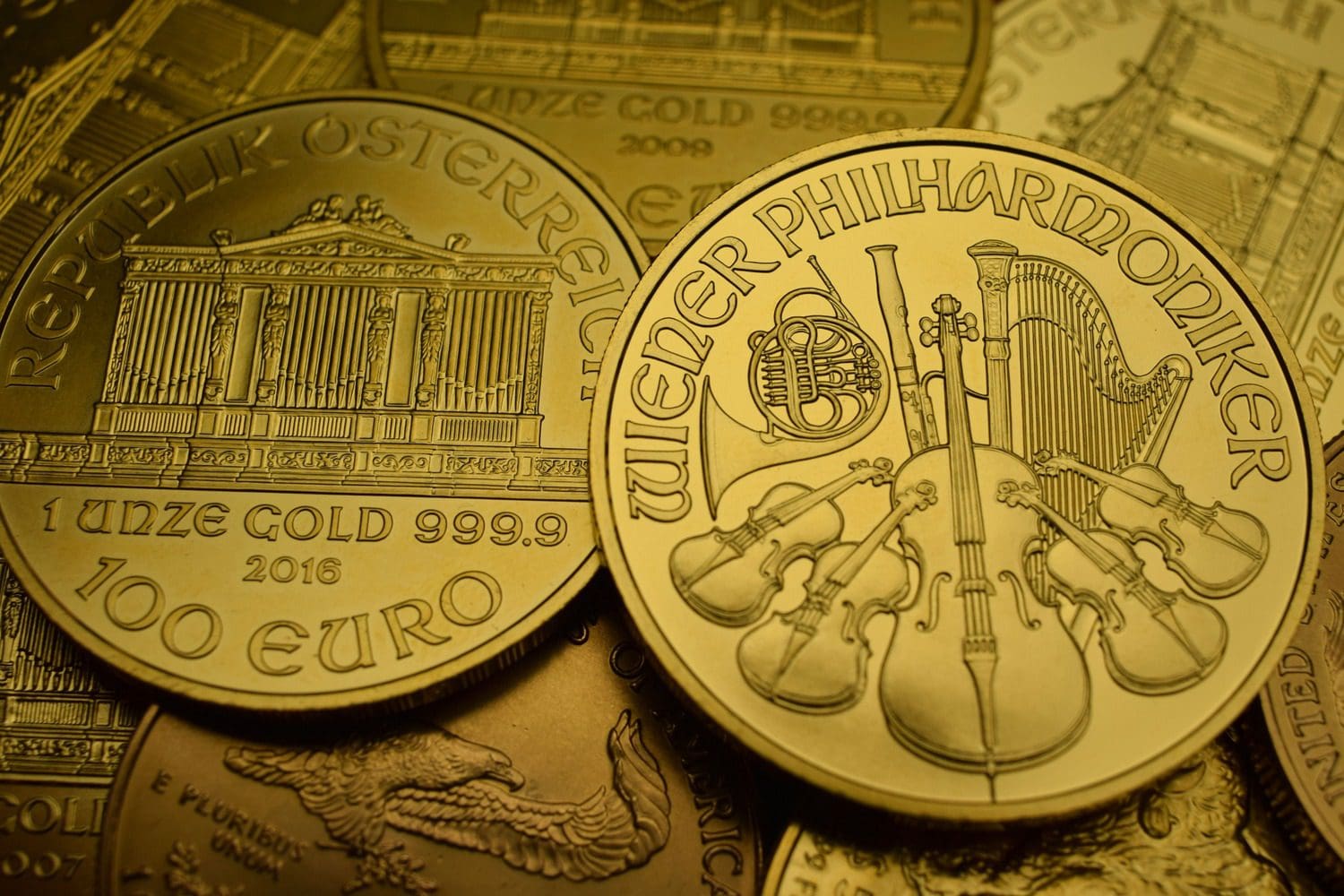 Close-up of gold coins with intricate designs
