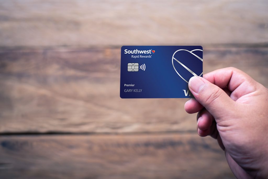 Hand holding the Southwest Rapid Rewards Plus Credit Card