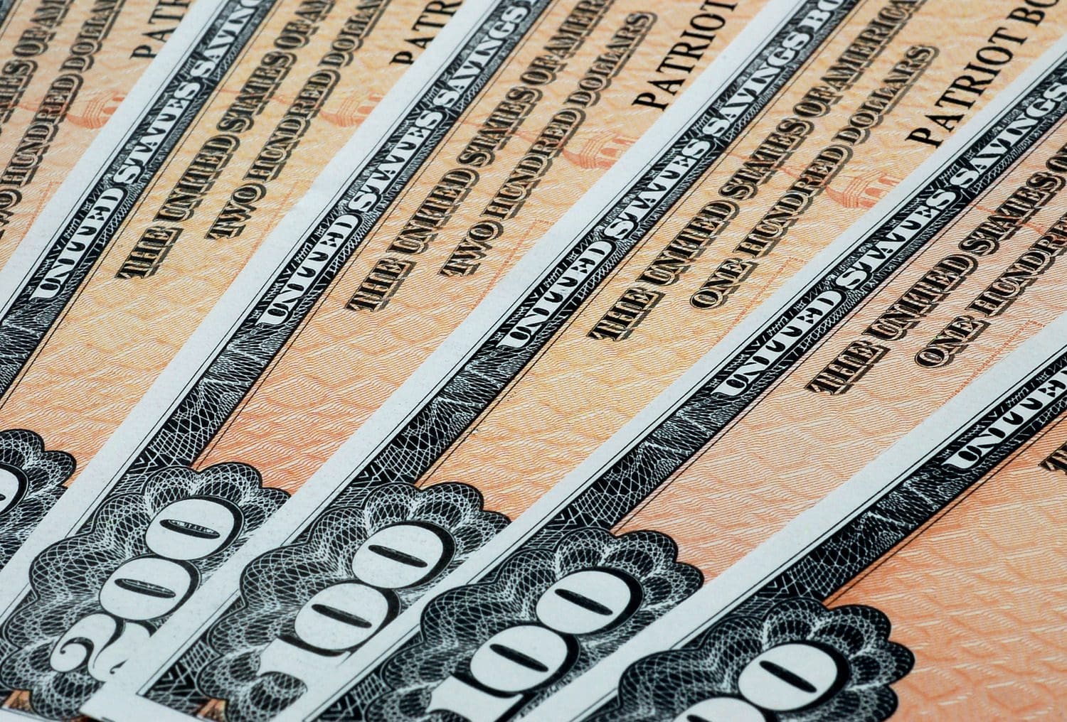 Physical United States Savings Bonds representing government-issued financial securities.