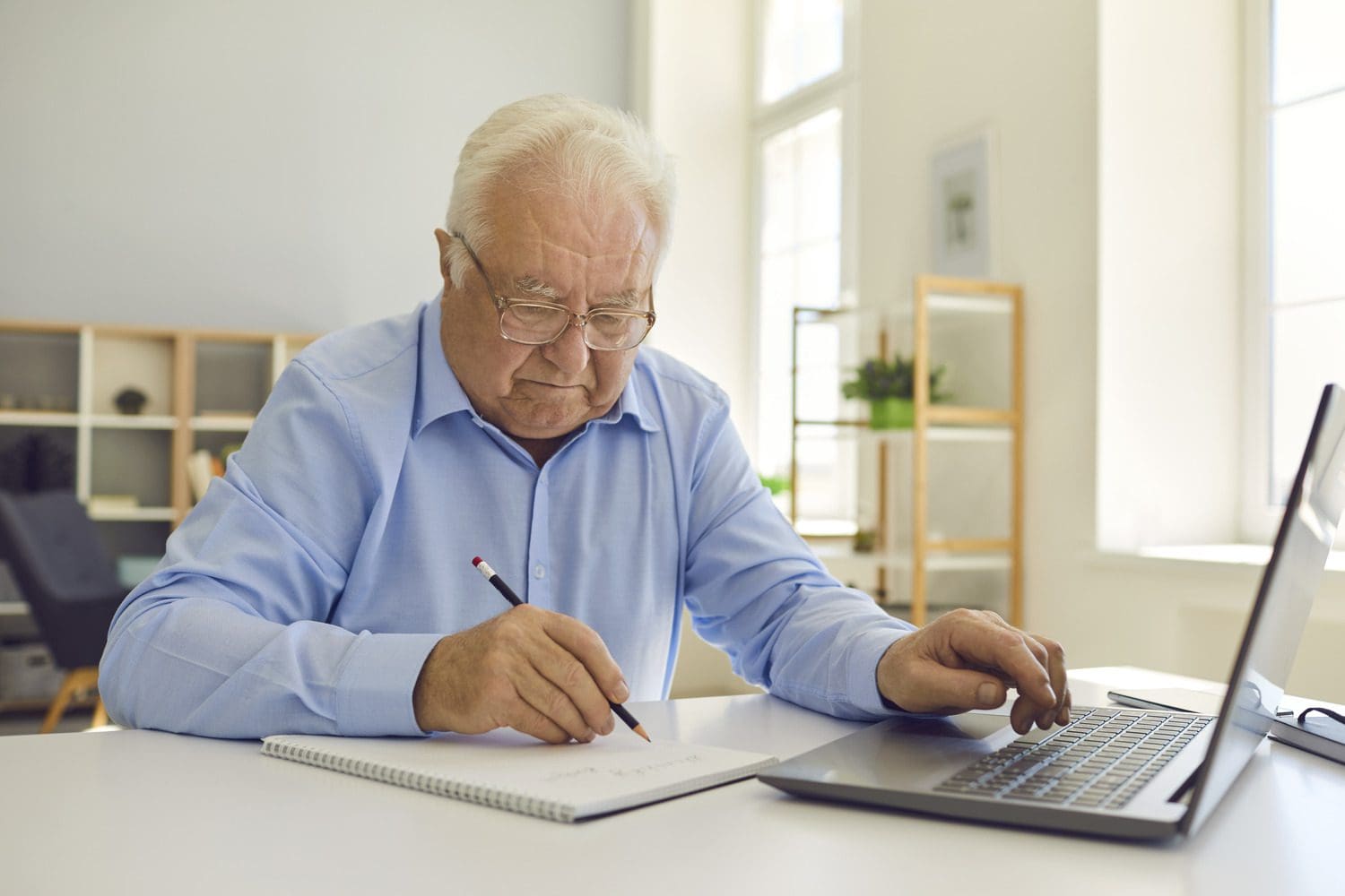 Man signing document at a desk