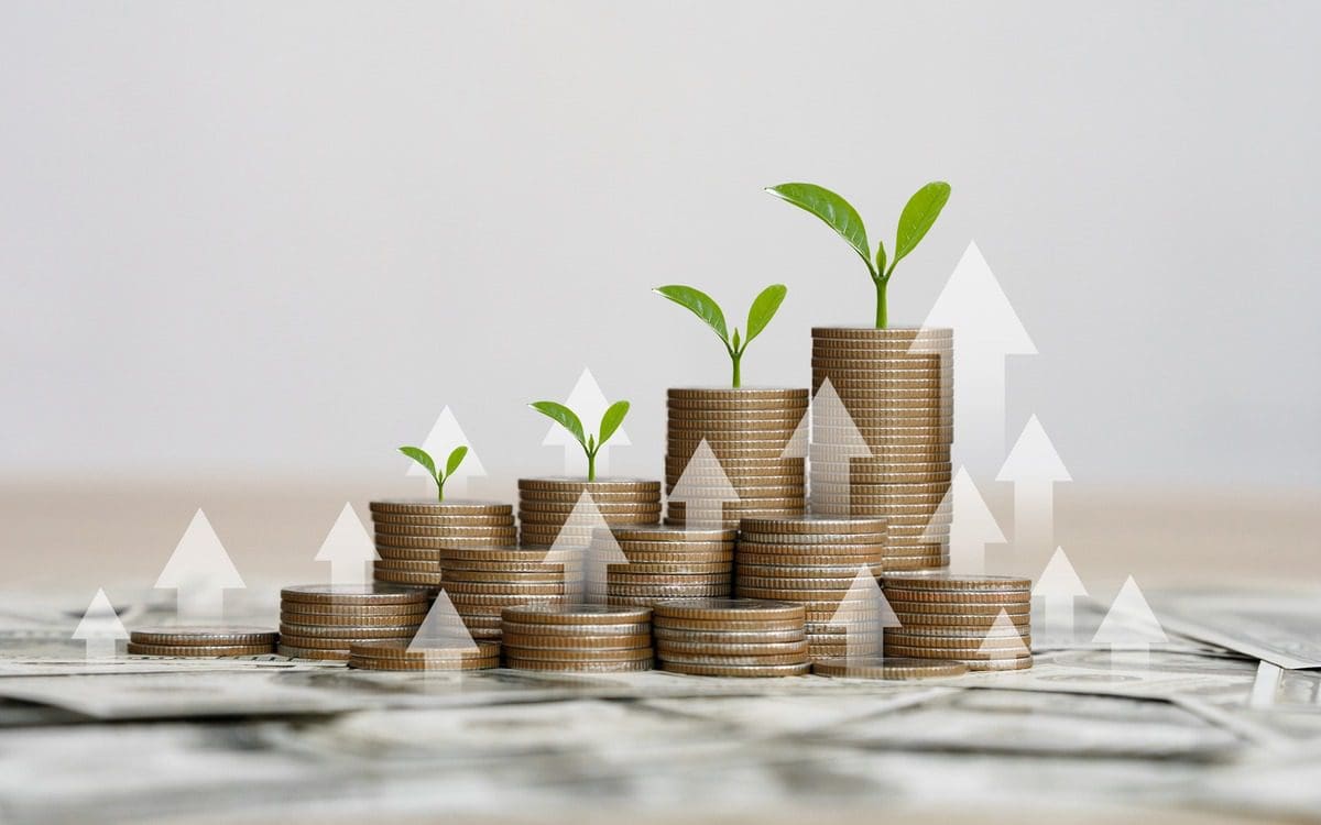 Coins with growing plants