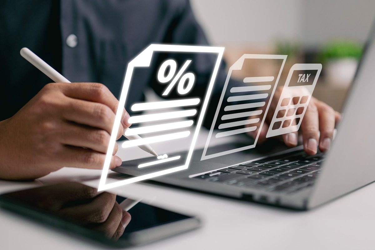 Laptop with tax calculator icon