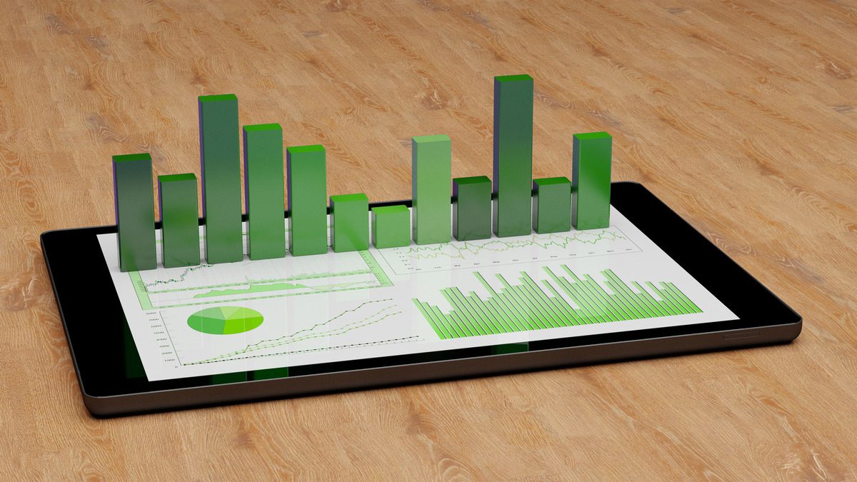 3D digital tablet displaying financial report with green bar charts and line graphs