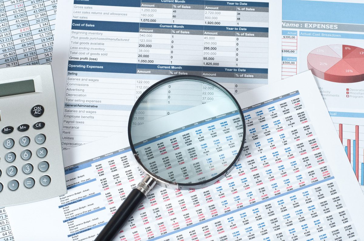 Financial report spreadsheets and charts used for calculating capital gains and investment analysis.