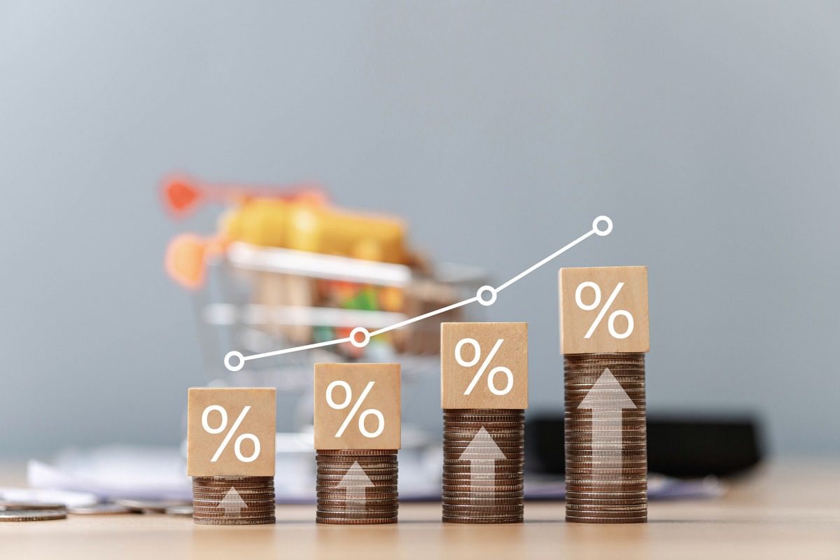 Stacks of coins with percentage symbols representing investment growth